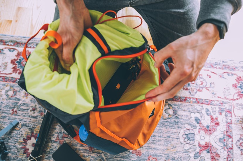 a clean external zippered pocket for the essentials is separated...