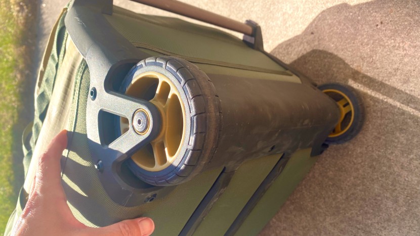 rei co-op big haul recycled rolling duffel 34" - the rugged wheel housing and bottom chassis of rei's big haul...