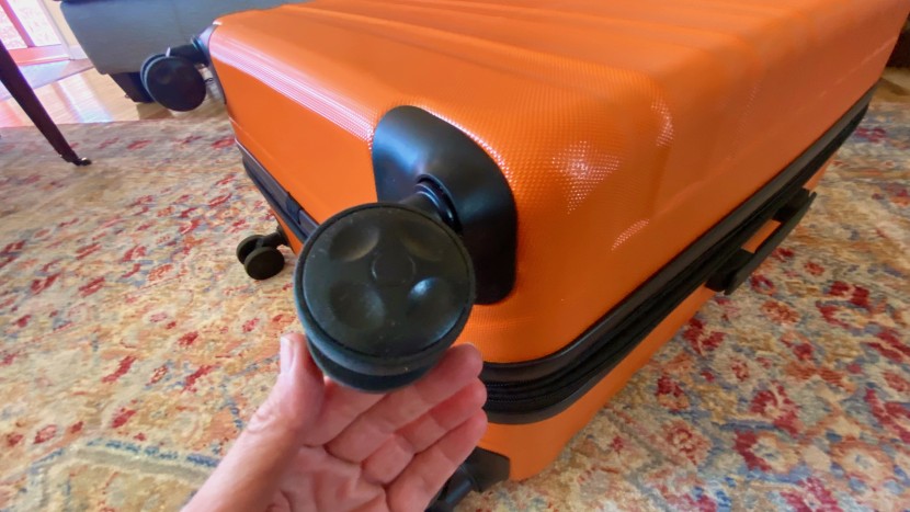 amazon basics 30" hardside spinner - close-up of the large two-wheel spinners on the amazon basics...