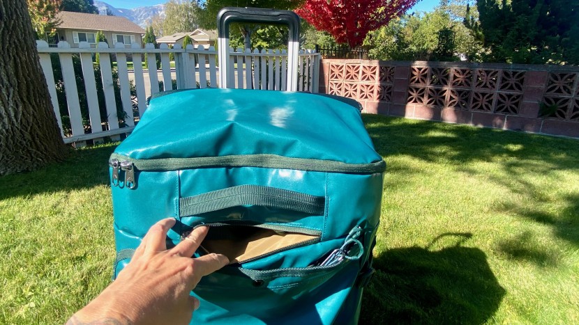 a small pocket entry at the top-front of the duffel hides a pair of...