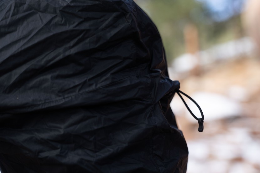 the helmet-compatible hood can be tightened with a single drawcord...