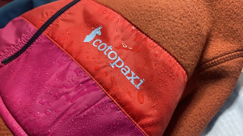 cotopaxi teca fleece hooded half-zip for women - the taffeta stripes repel water, but they're not stretchy, which can...