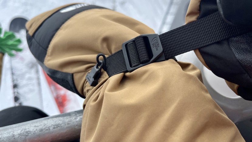 the nylon wrist strap secures the mittens over the hands and adds a...