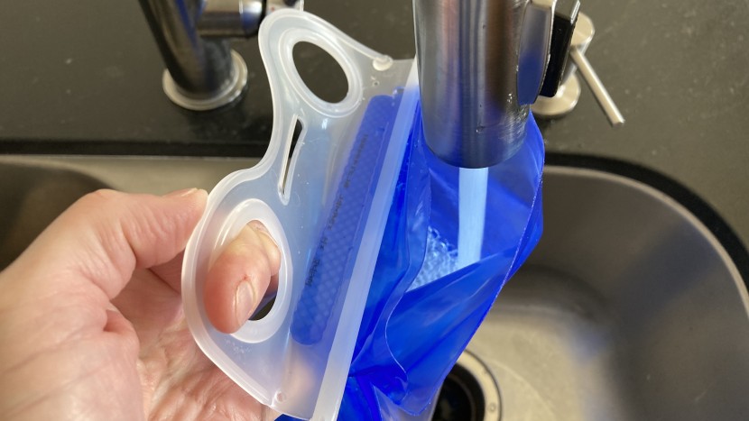 deuter compact exp 14 - the holes built into the bladder help with holding it while filling...