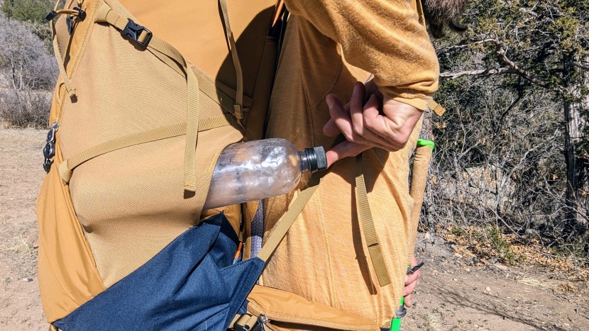 the right-side water bottle pocket has a forward-facing opening so...