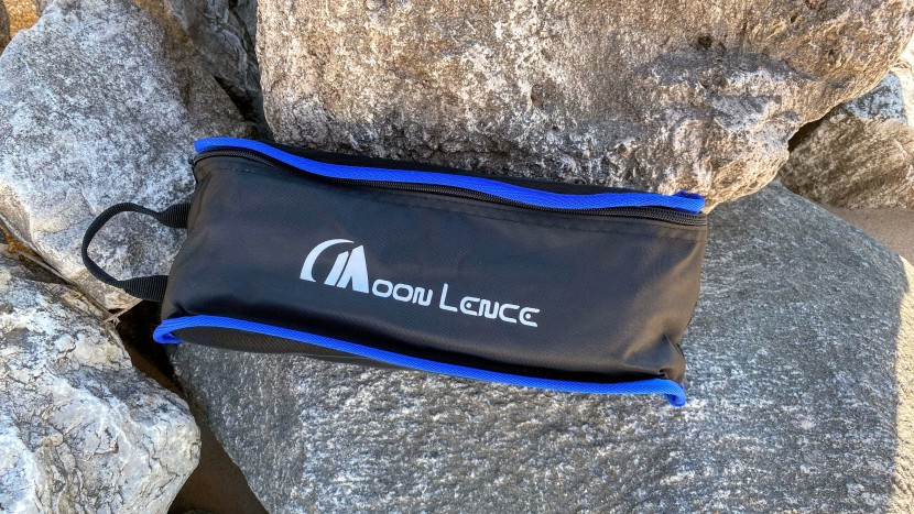 the carrying case is about the length of a forearm and has a handle...