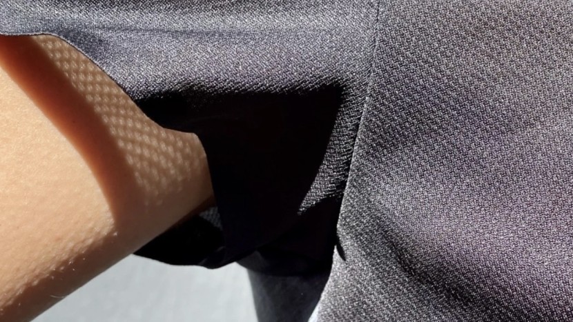 running shirt womens - a closer look at the taped seams and breathable weave of the on...