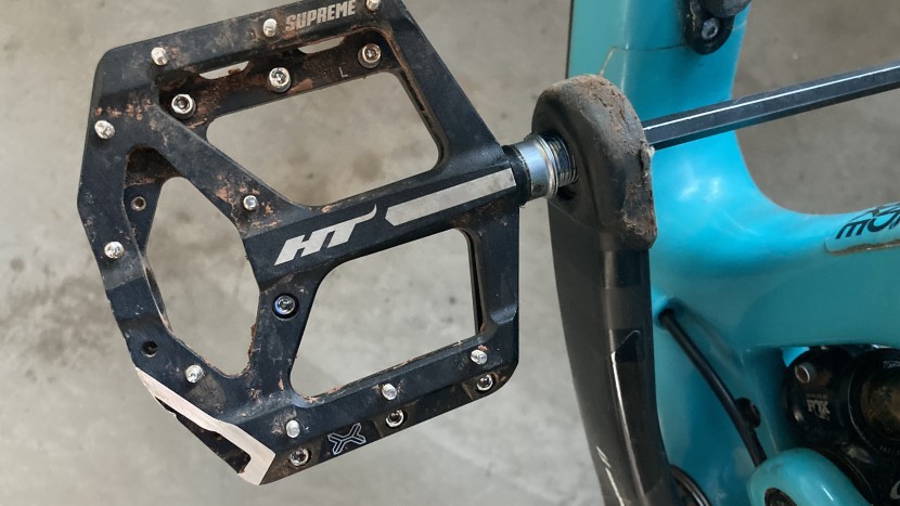 bike pedals - here a pedal is being installed using a hex wrench. pedals are...