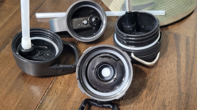 water bottle - an assortment of hard plastic lid styles with silicone gaskets.