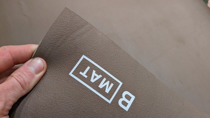 the b mat has a tacky texture on both sides that won't slip on your...