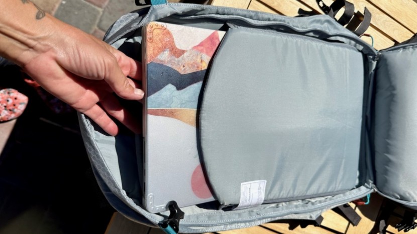 school backpack - the well-padded laptop sleeve tucked into a designated compartment...