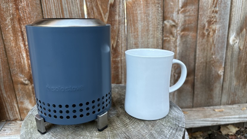 fire pit - a coffee mug next to the solo stove mesa showcases the compactness...