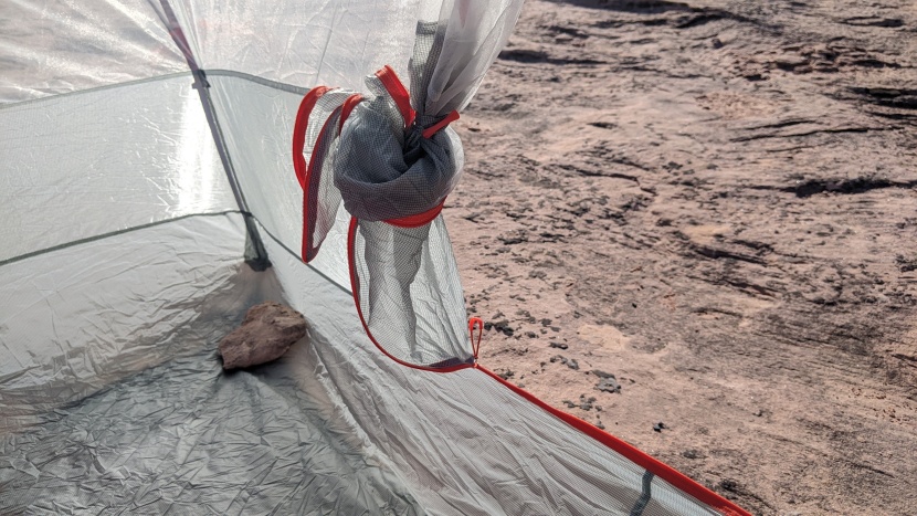 you can tie the door back with a plastic toggle or stuff it into a...