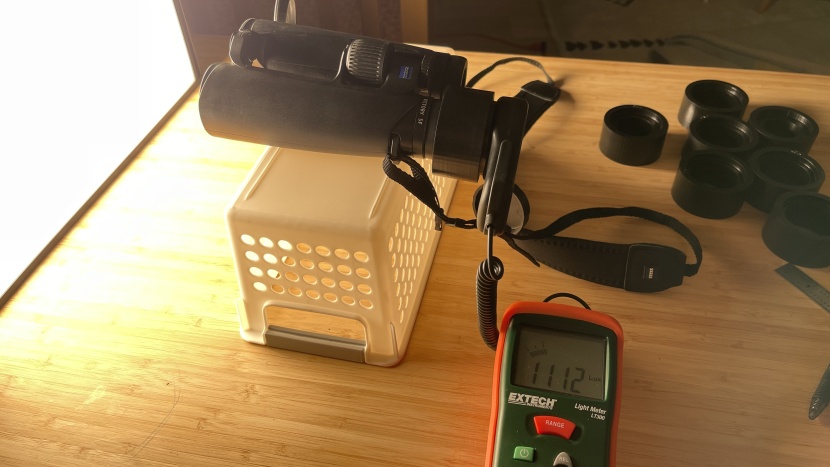 binoculars - measuring light transmission in our controlled test setup.