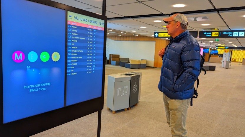 sporting only the down layer as we check the departure listing in...