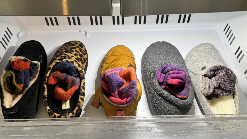 slippers - a selection of slippers is put in the freezer to test how warm they...