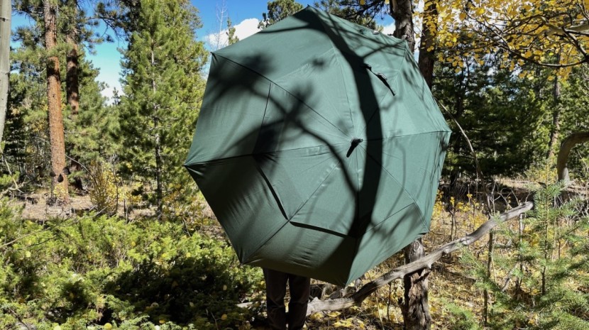 shorter users practically disappear under the large canopy of the...