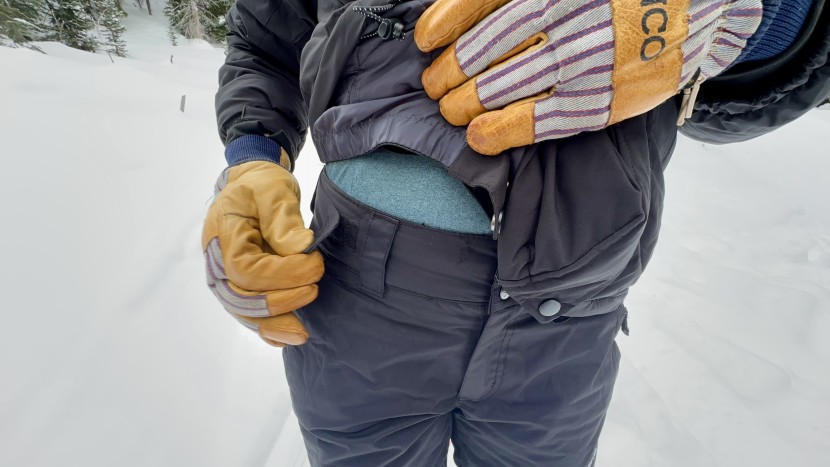 the adjustable velcro waist of the arctix covers the gap between leg...