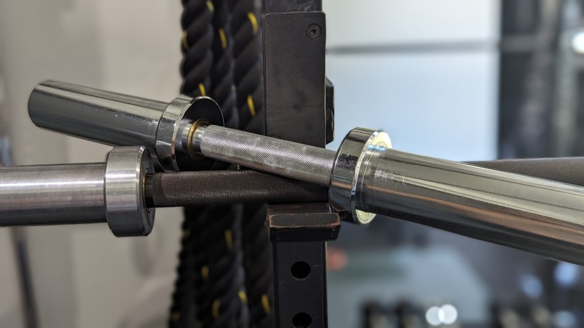 titan fitness loadable olympic handles - the titan handle (silver, on top) is built like a miniature barbell;...