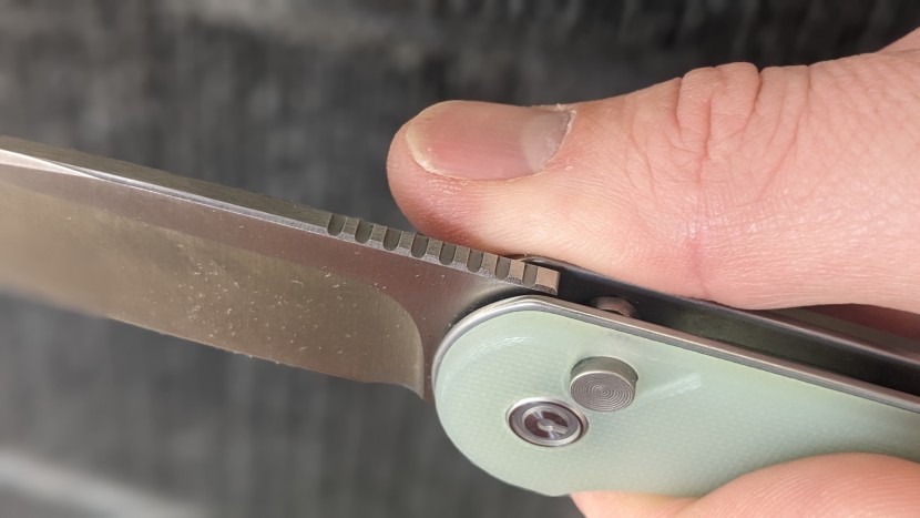 civivi button lock elementum ii - the jimping along the spine of the blade offers an aggressive, but...