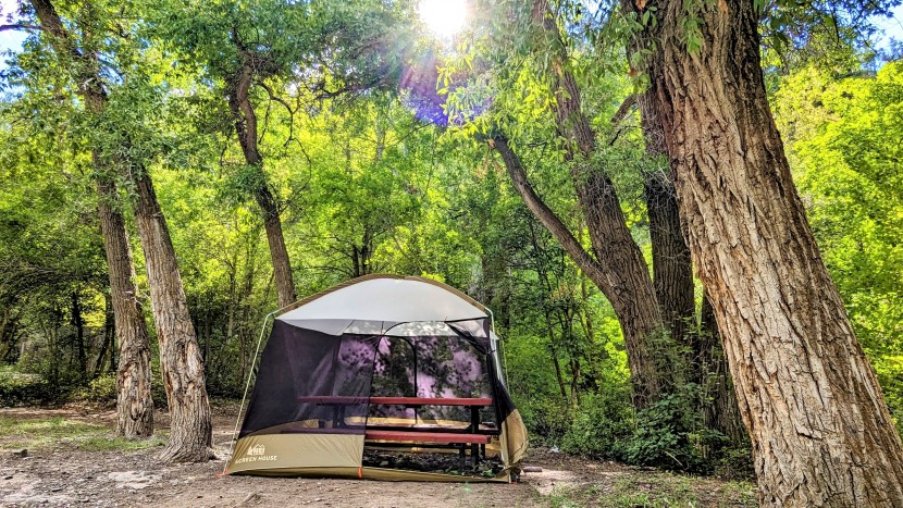 camping list - an enclosed canopy tent placed over a picnic table can help keep out...