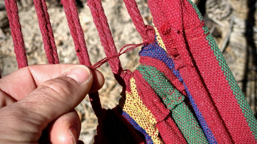 red flags like frayed strings and missing reinforcements at...