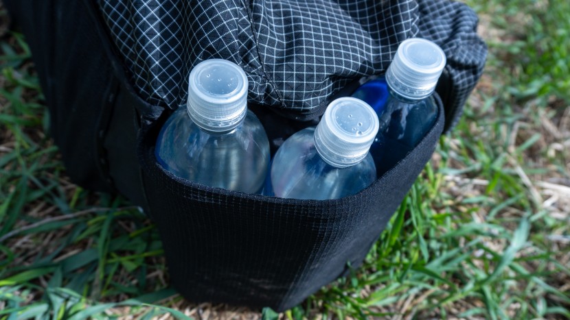 the bottom stash pocket can fit three, one-liter smartwater bottles.