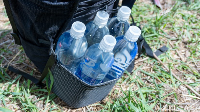 each side pocket can squeeze in up to 5 one-liter smartwater bottles.