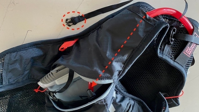 hydration pack - the arrows show how the hose routes through the pack's shoulder...