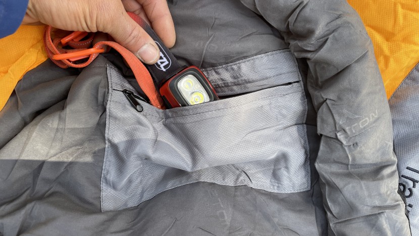 backpacking sleeping bag - a zippered pocket on the inside to hold odds and ends is a feature...
