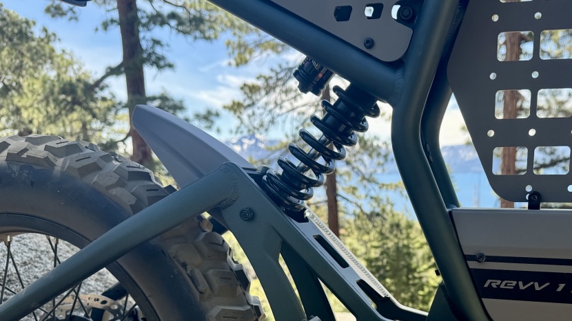 the dnm coil shock provides 76mm of travel and features adjustable...