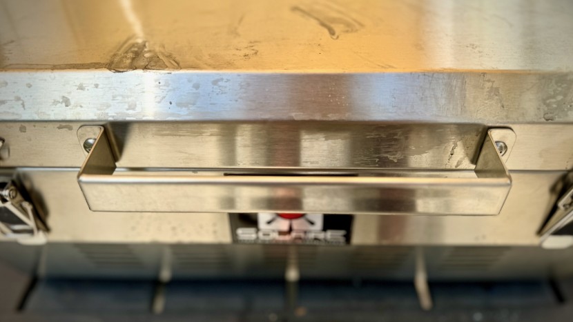 handles on each side of the grill help increase the portability of...