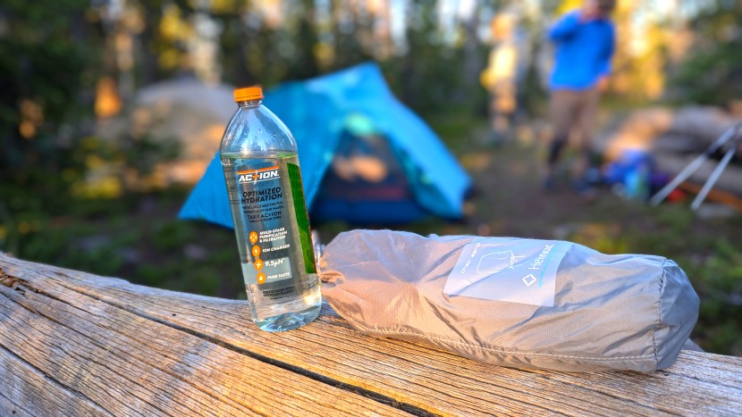 helinox chair zero - chillin' on a log with a bottle of water. the helonix stuff sack is...