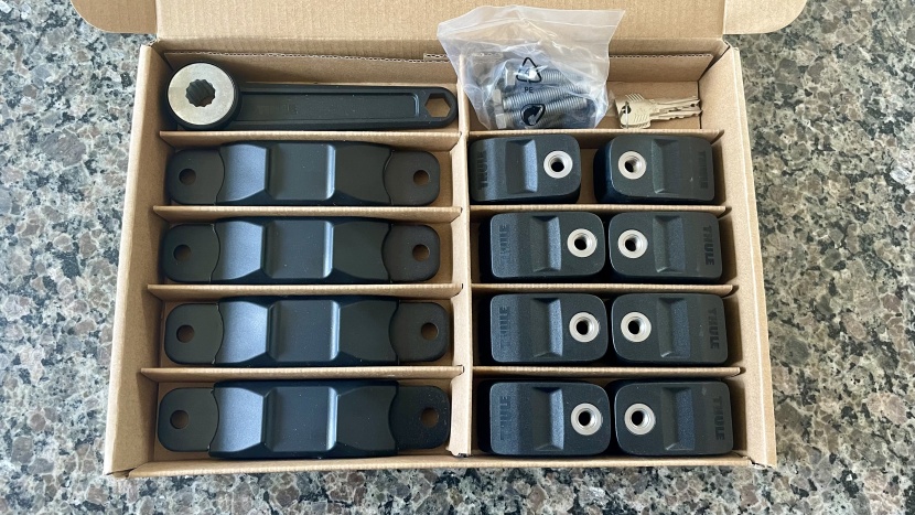 the thule's hardware comes neatly organized and ready to assemble.