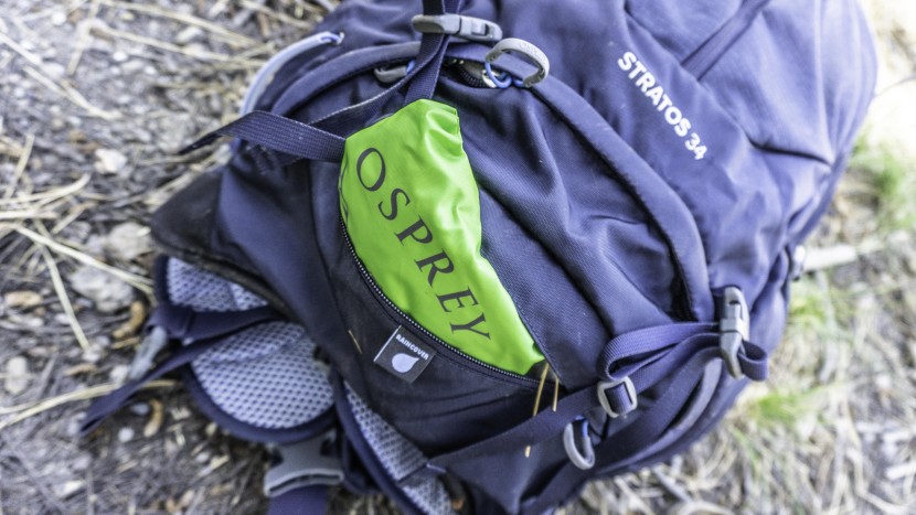 daypack - the osprey stratos 34 includes a rain cover stashed into a dedicated...