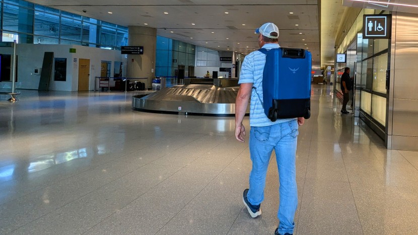 heading to grab our checked bags at logan international airport in...