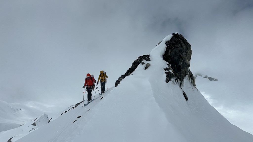 backcountry skis - wild mountains, incoming weather, variable snow; three conditions...