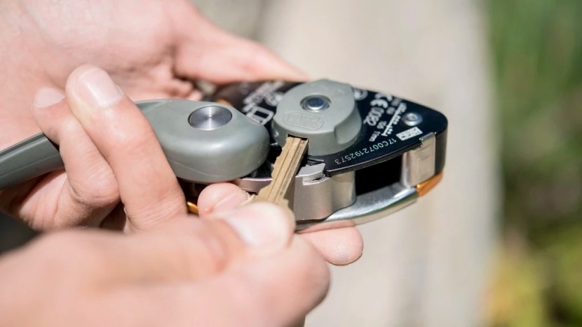 to switch modes, first unlock the dial with a thin, stiff object...