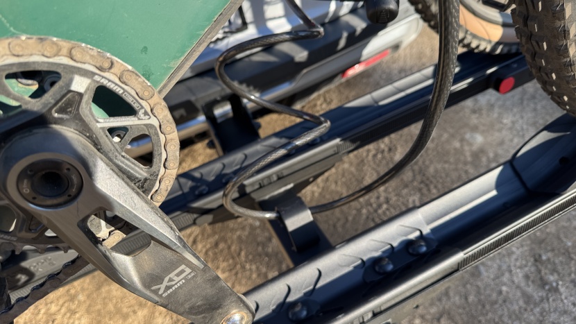 the 12mm cable runs through a loop welded to the rack's main frame.