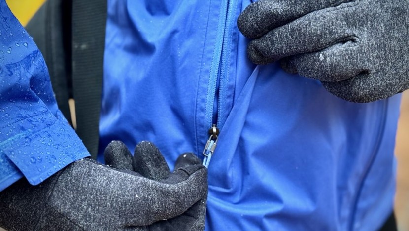 the jacket features flaps that cover the zipper to further increase...