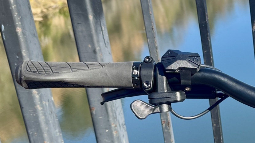 lectric one - the thumb paddle throttle is on the handlebar's left side with the...