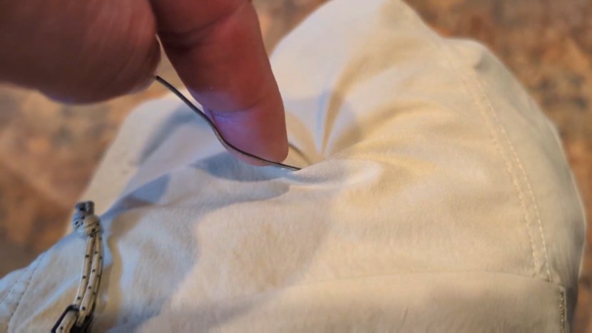 pulling the end of a paperclip across the fabric is an easy way to...