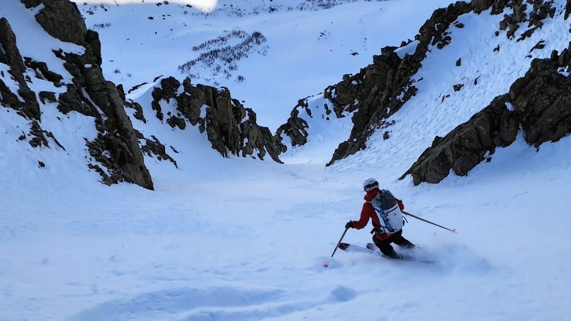 couloir skiing in the patagonia storm.