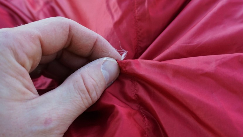 backpacking sleeping bag - a down cluster is trying to escape. remember, pull from the inside...