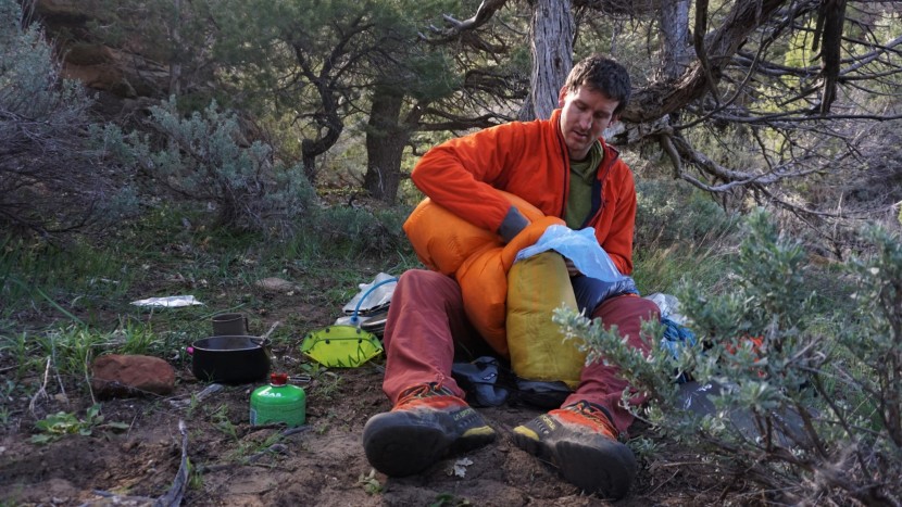 backpacking sleeping bag - down provides almost zero insulation if it gets soaked. avoid this...