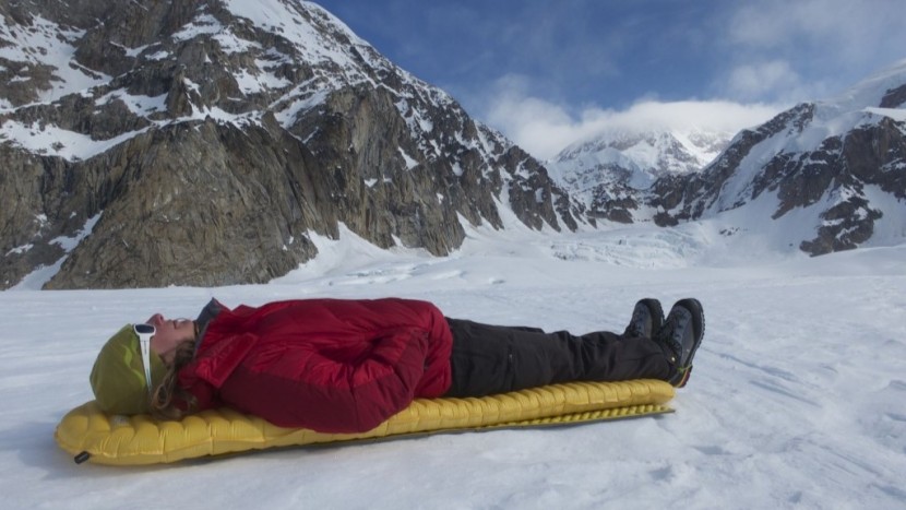 backpacking sleeping bag - using a warmer sleeping pad, or using a foam pad and an inflatable...