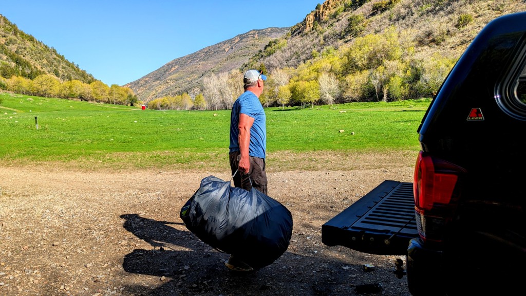 zempire evo tm v2 inflatable air tent - lugging our air tent from truck to meadow. this monster is heavy and...