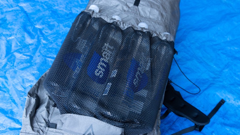 the stretchy center pocket can be persuaded to fit four, 1-liter...