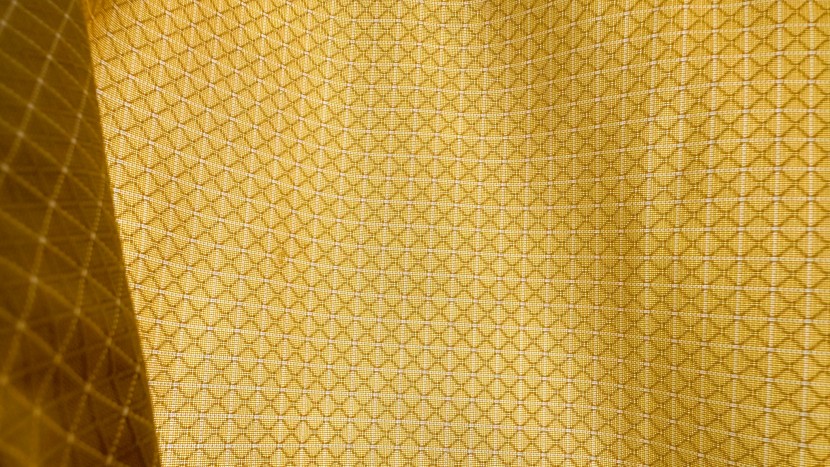 the grid pattern of material helps strengthen the nylon and help it...