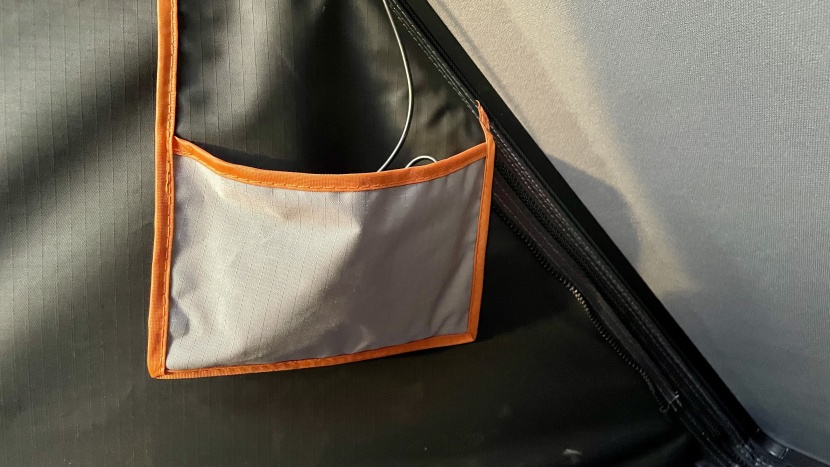 the small side pockets near the bottom of the wedge house the led...